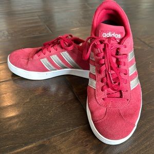 Adidas suede sneakers in a deep red color with gold stripes. Woman’s size 6.5